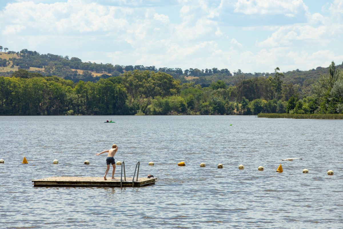 Boy diving from a pontoon