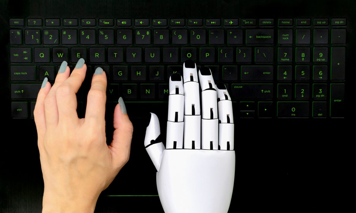 Hand and robot hand typing