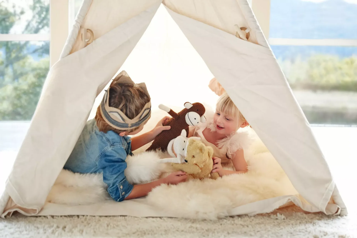 Kids playing in a tent