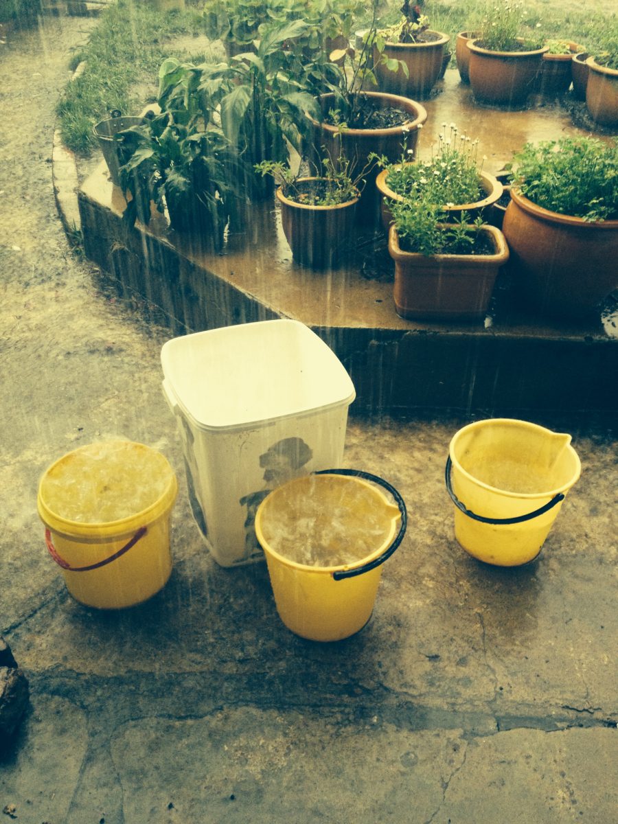 Rain falling into buckets