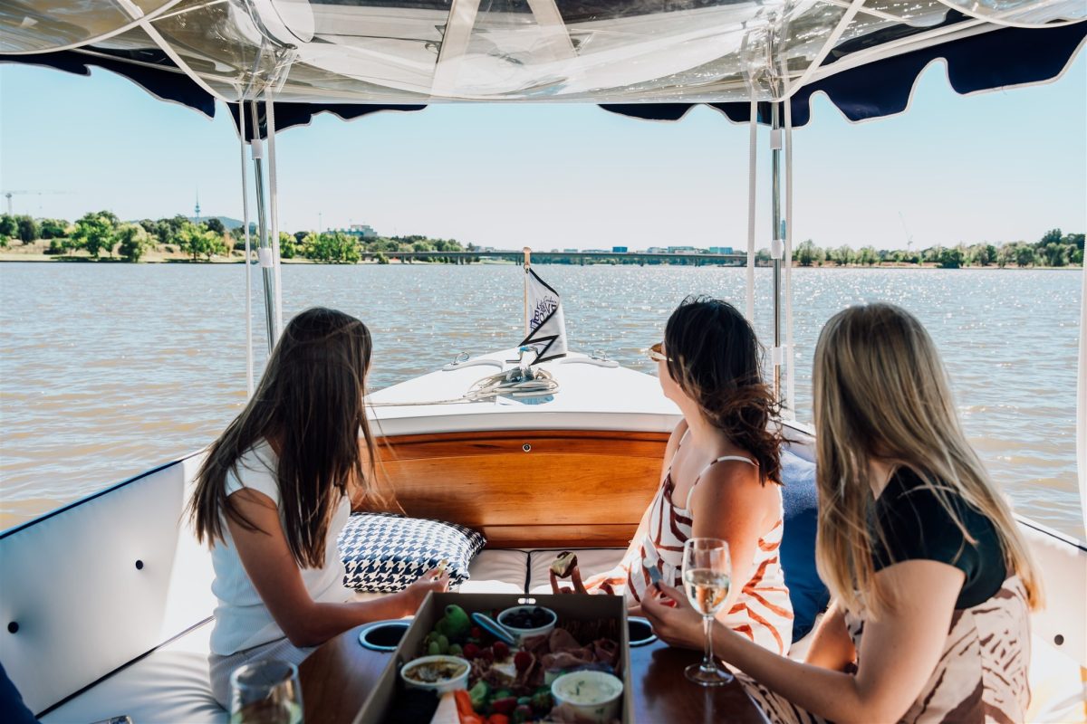 women on an electric boat