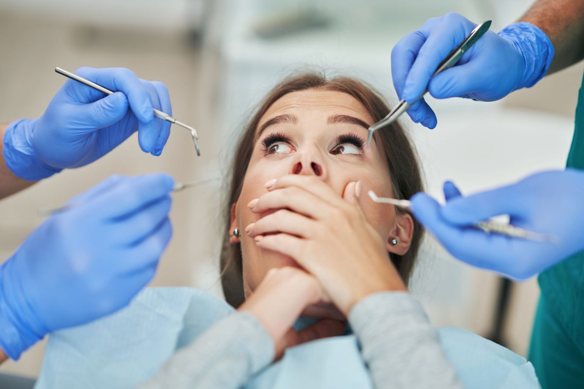 Scared woman in dentist chair