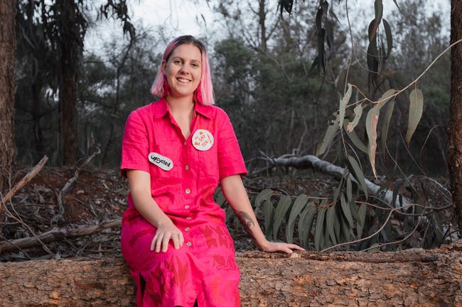 Millie Hocking sitting in bushland