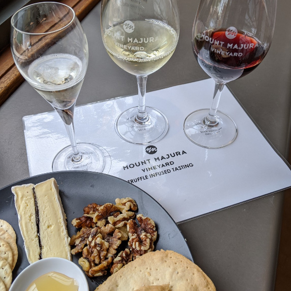 Truffle cheese and wine on table