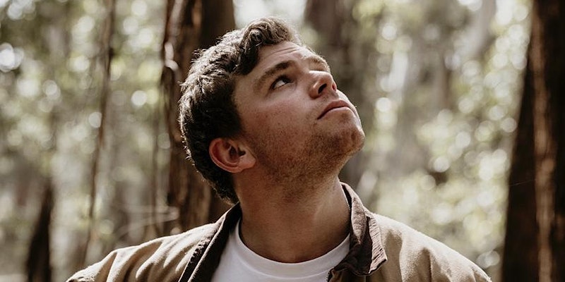 Oscar Litchfield looking up in bushland