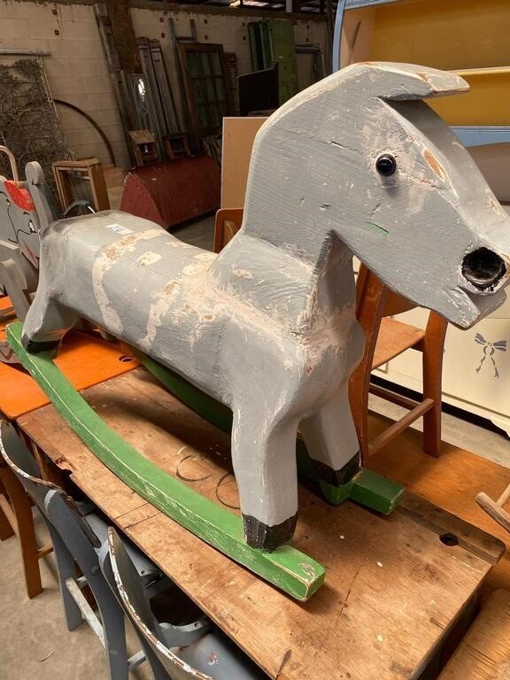 Grey wooden rocking horse.