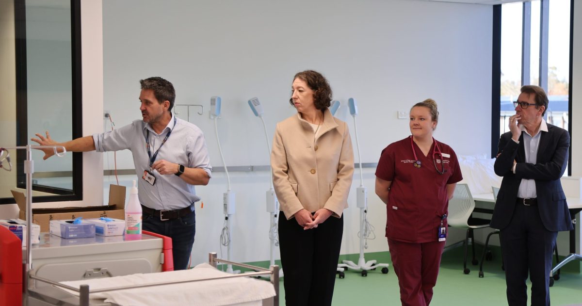 four people in a medical ward