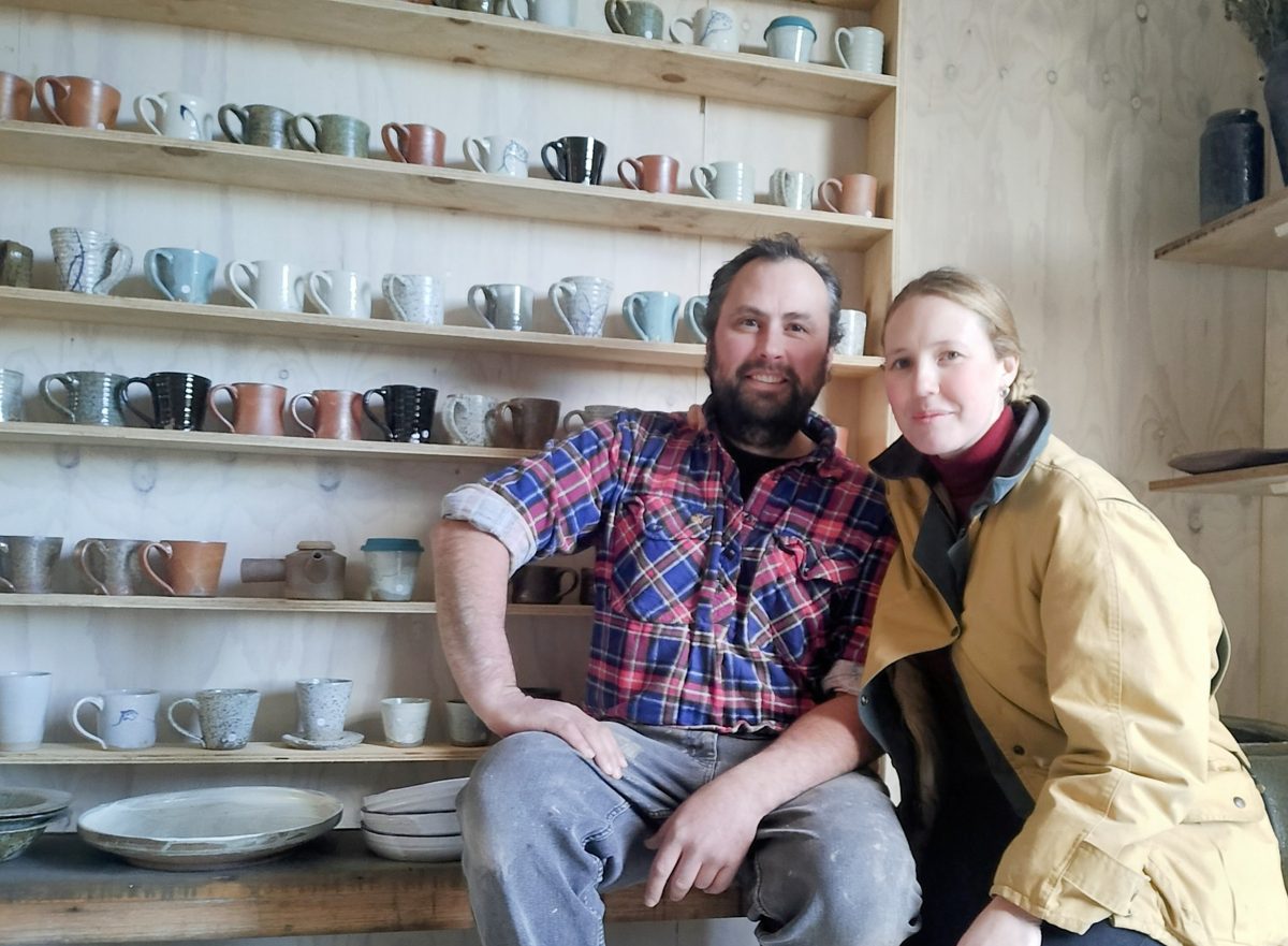 man and woman with pottery