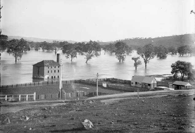 Gundagai's oldest surviving building, the Old Mill, seen here surrounded by water during the 1900 flood, has been the focus of attention in the town lately with plans afoot to develop a masterplan and attract funding for redevelopment of the site. 