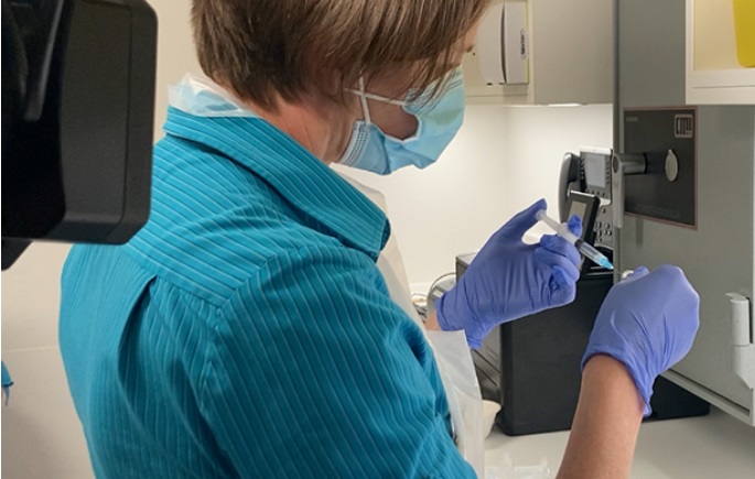 woman preparing a vaccination