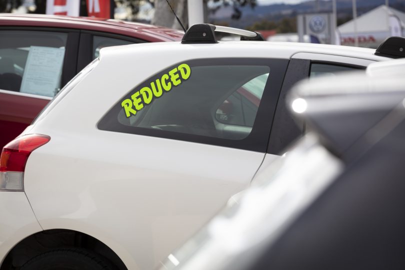 reduced price tag on car