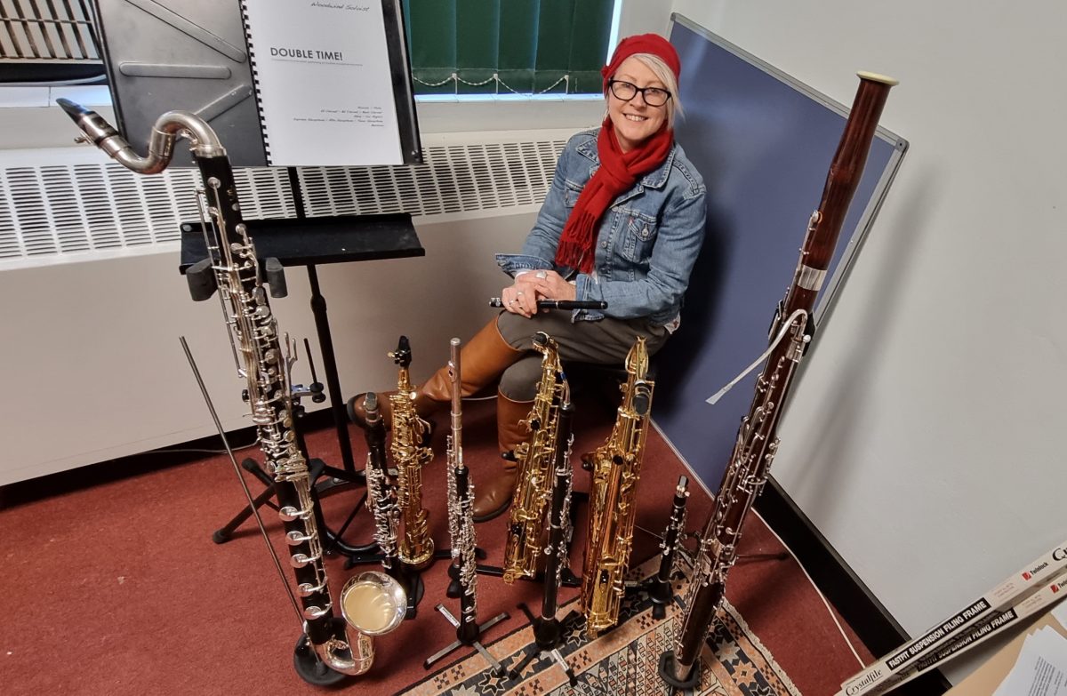 Kara Williams surrounded by her many instruments