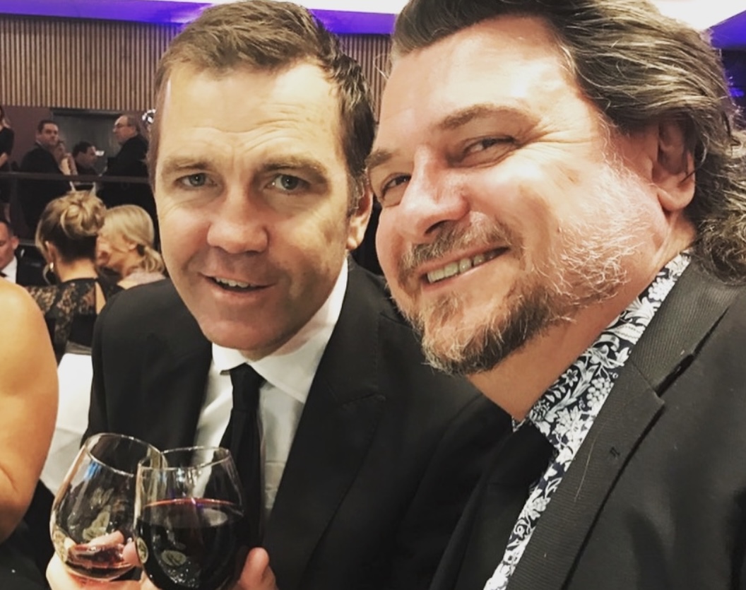 Matt Callander and Glenn Pallister at a gala event with wine
