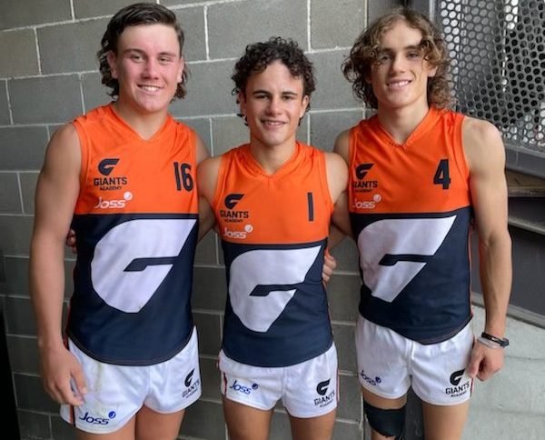 Three young men on the Griffith AFL team