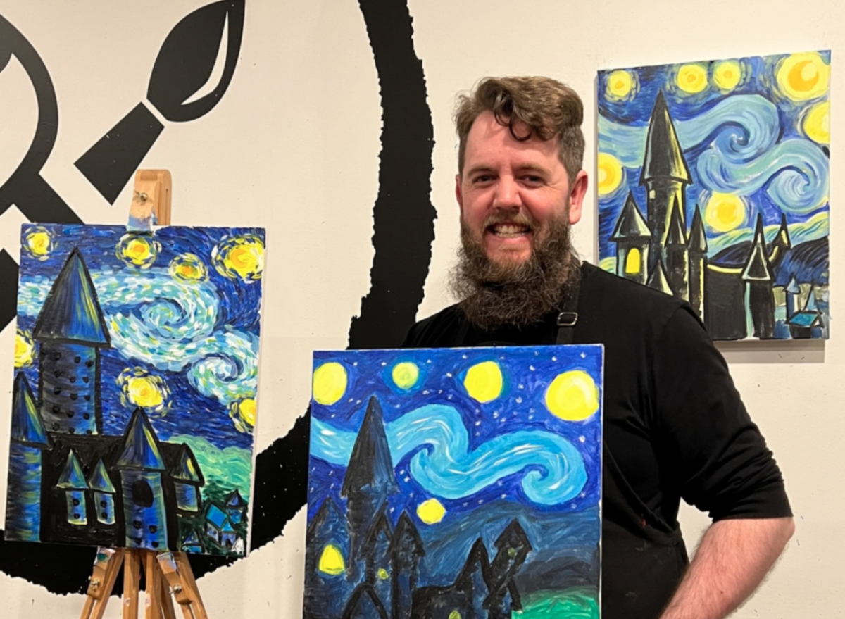 A happy artist with a recreation of Van Gogh's Starry Night