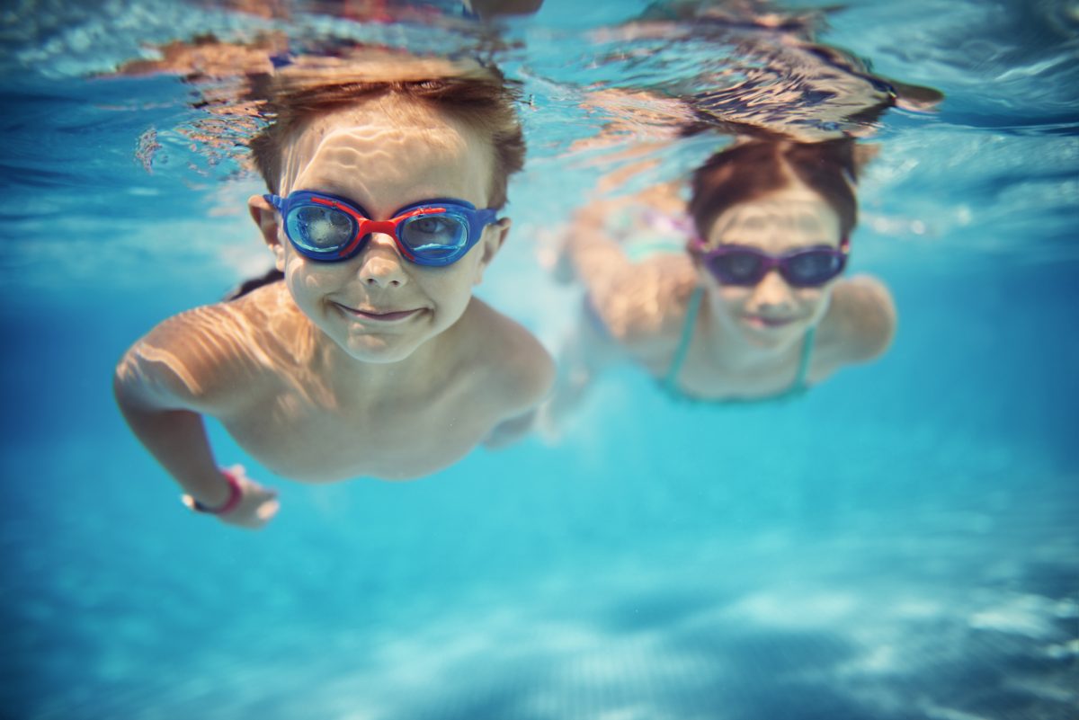 Two kids swimming