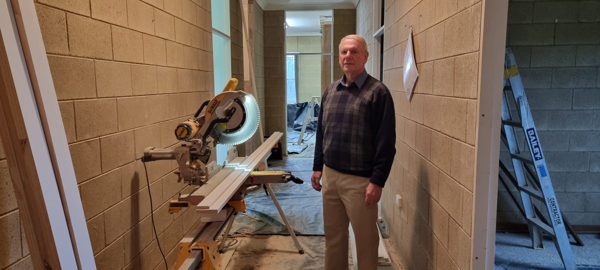 Doctor Gordon Saggers standing among renovations
