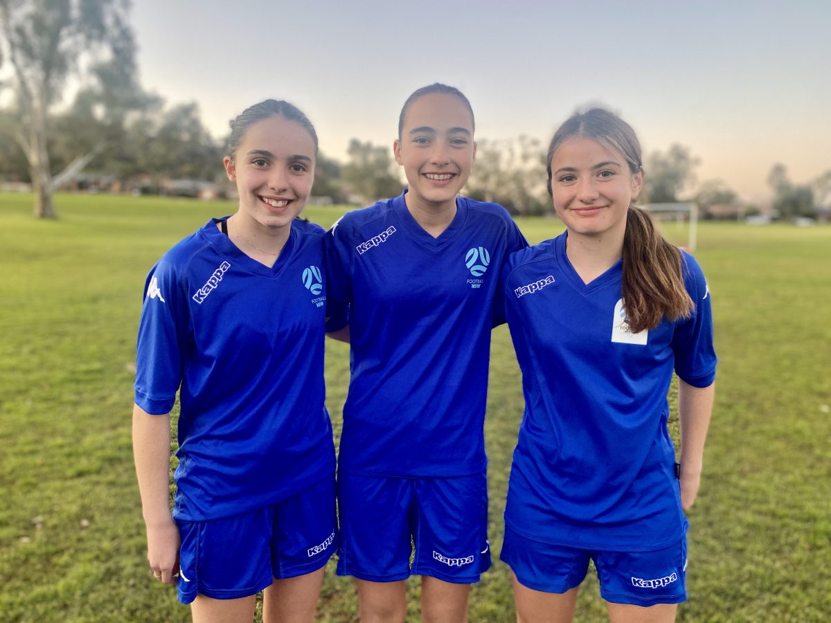 Three female soccer players