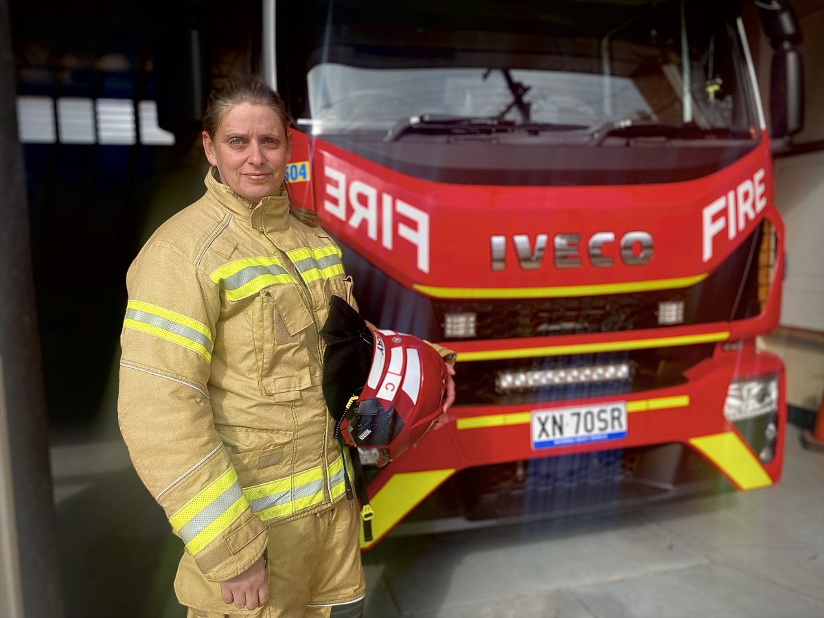 Danielle McKay in front of fire truck