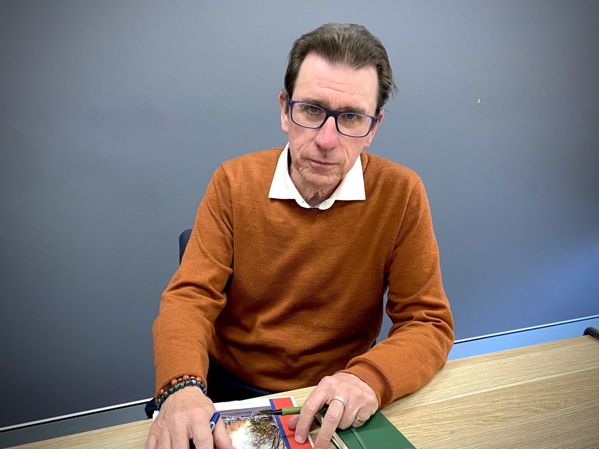 MP Dr Joe McGirr at desk