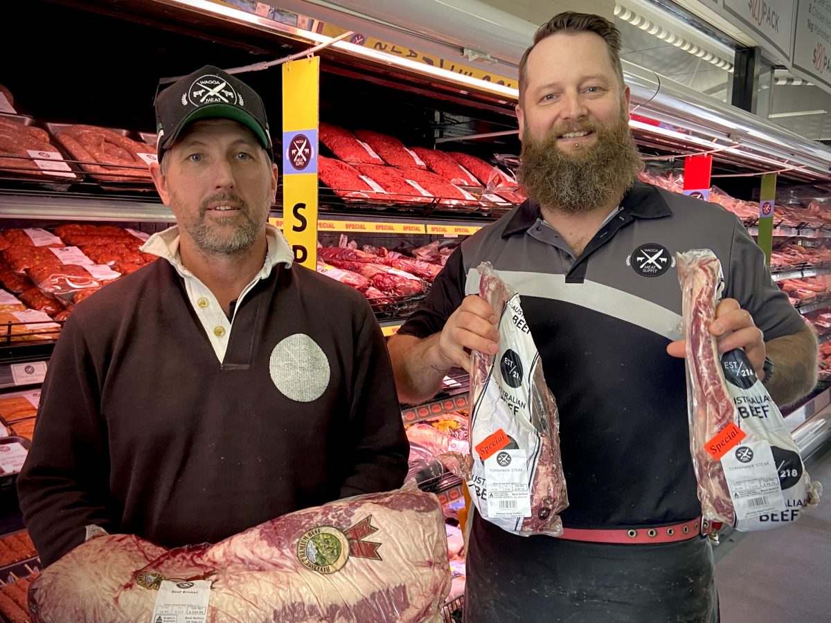 Andrew Nelson and Mick Cameron from Wagga Meat Supply holding meat cuts