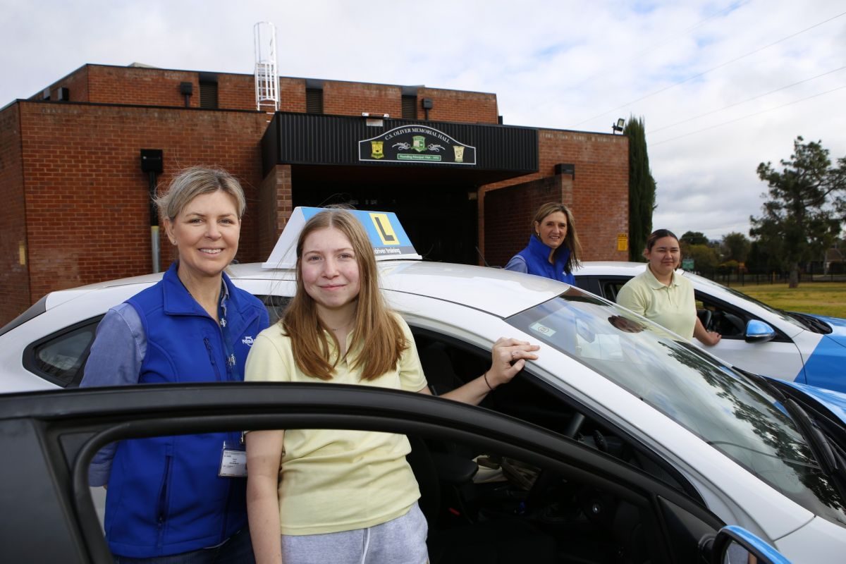 Sarah Wardman and Christine Hillis from the NRMA Safer Driving School with Mount Austin High School students Yazmin Gambold and Rosa Knapp.