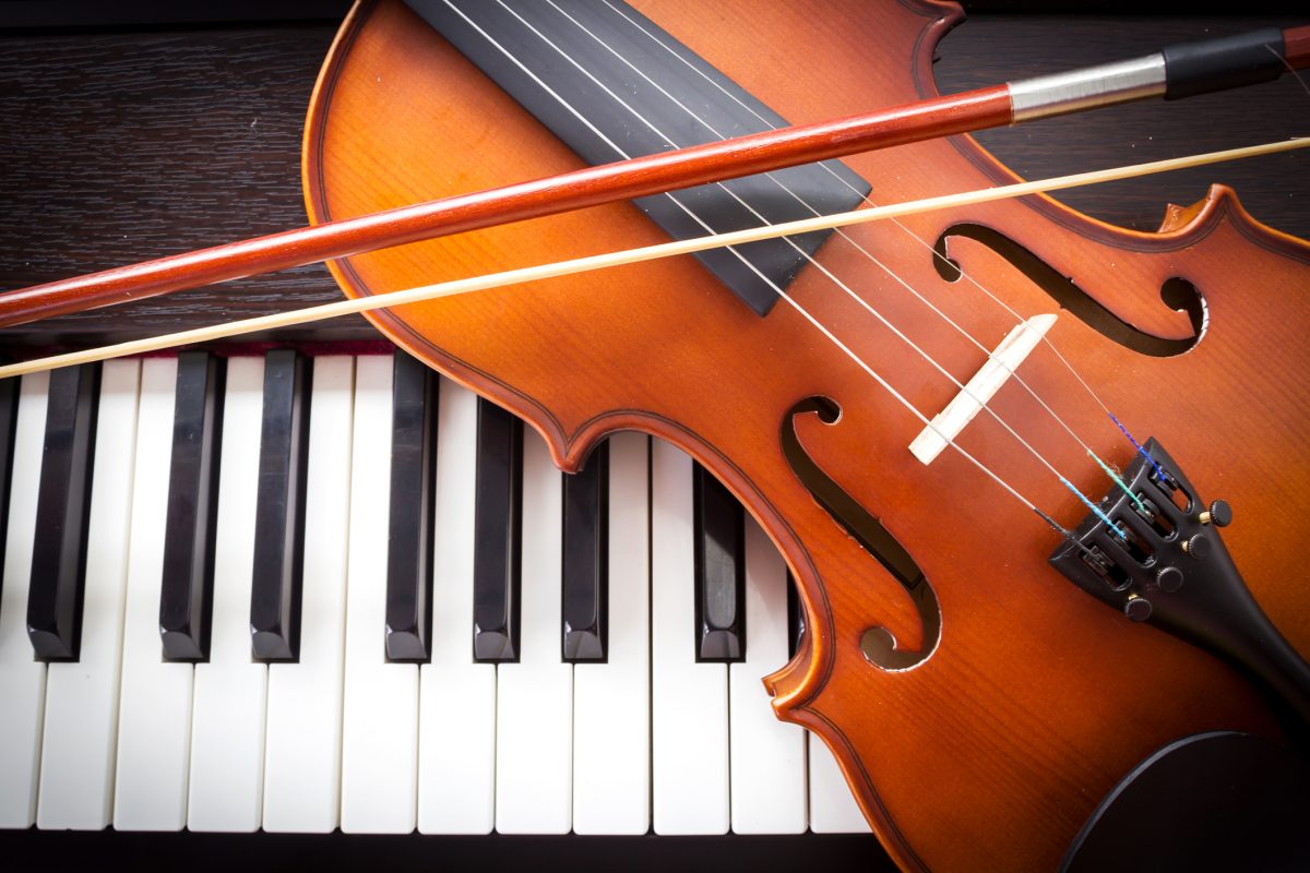 Violin on piano keyboard.