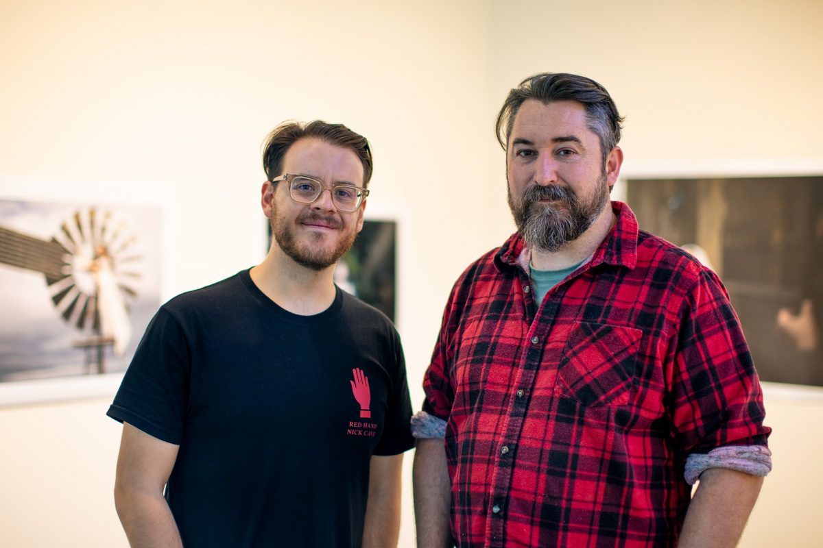  Two men in art gallery