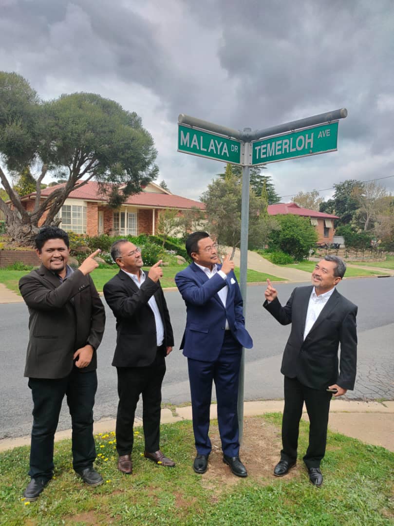 Men and street sign