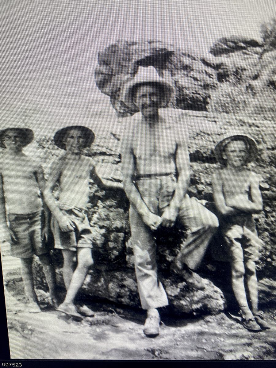 Griffith hermit with friends outside his cave