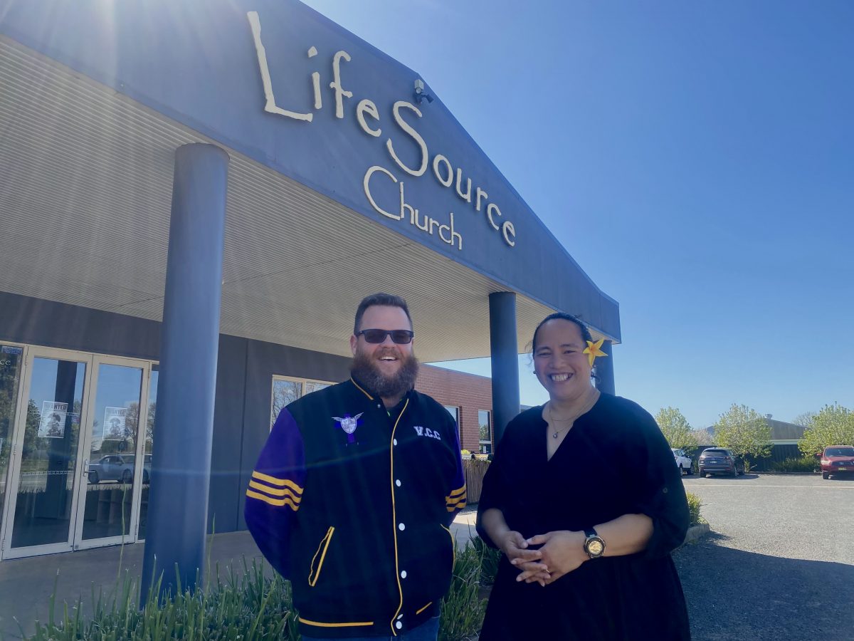 Steven Rand and Theresa Mataora outside LifeSource Church in the sun.. 