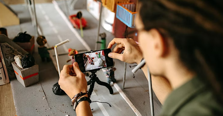 Person using phone to film stop motion