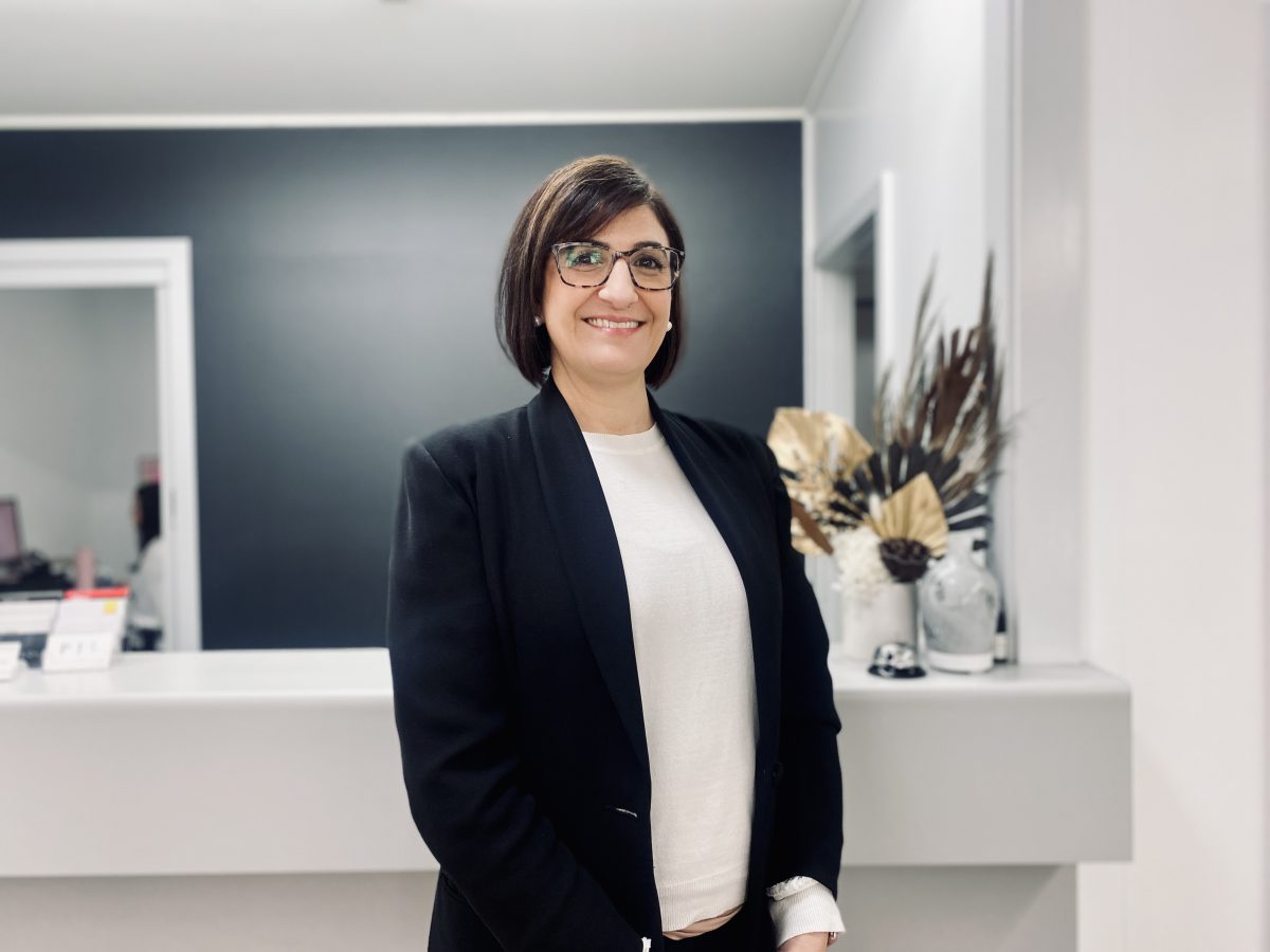 Karen Giovinazzo standing at her firm