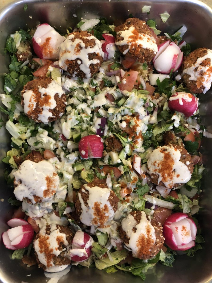  vegetarian falafel salad with tahini sauce.