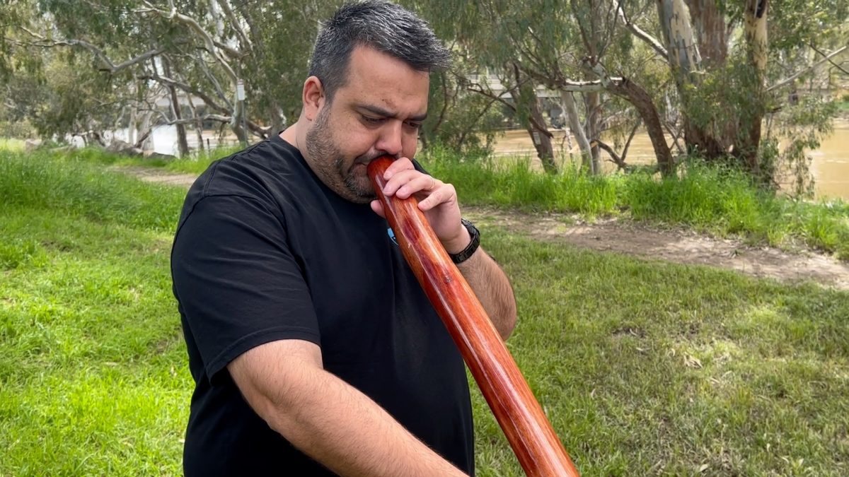 Man with didgeridoo