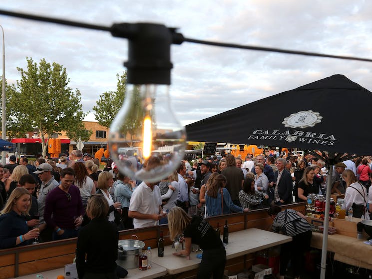 Crowd at an outdoor bar