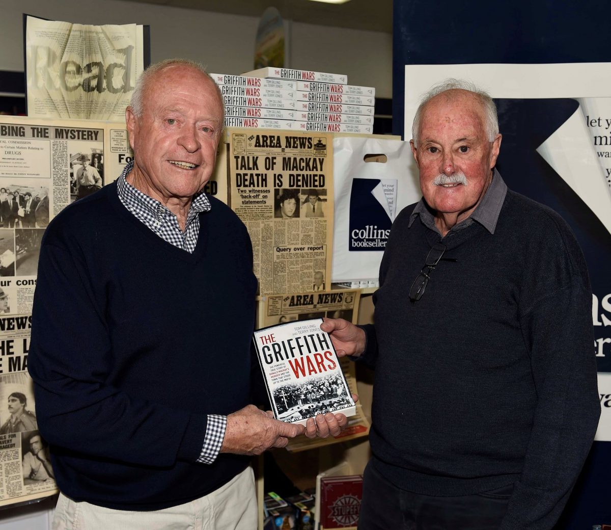 Terry Jones (right) with crime scene photographer Max Roberts and a copy of The Griffith Wars