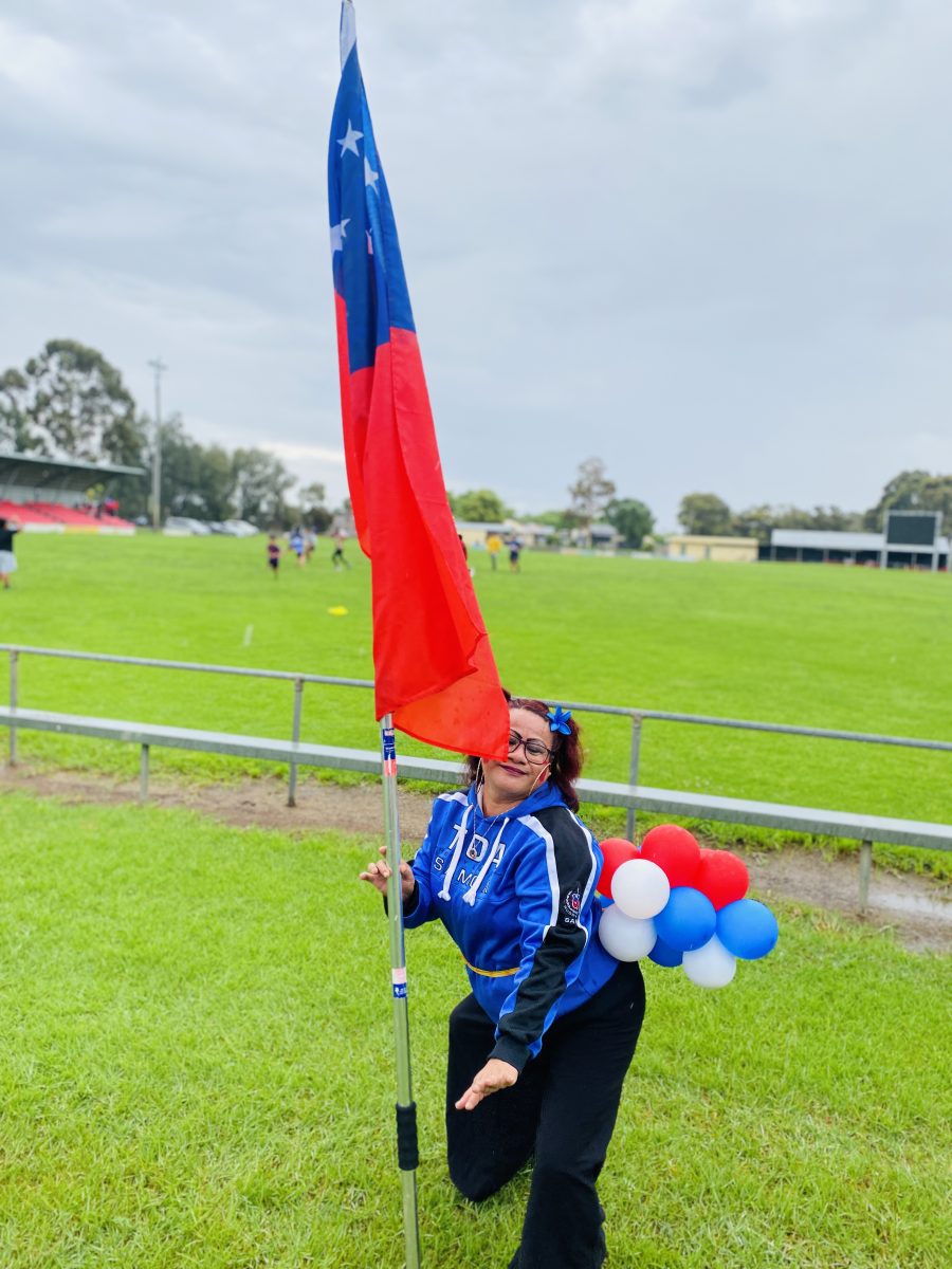 Laylah Pulega dances with Samoan flag