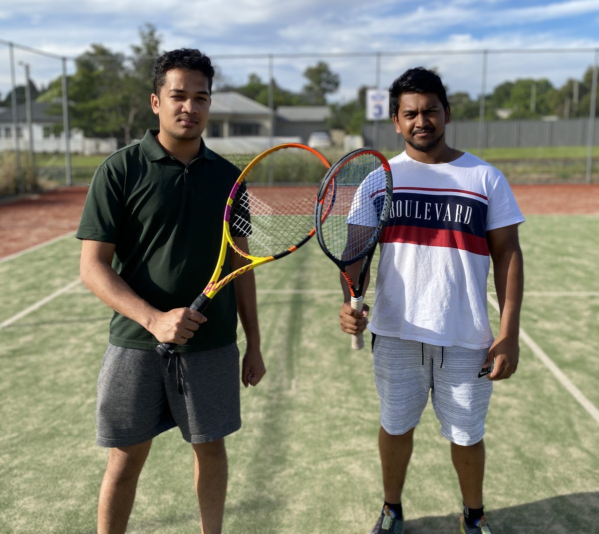 Ketan Panat and Sahil Kapoor holding tennis racquets