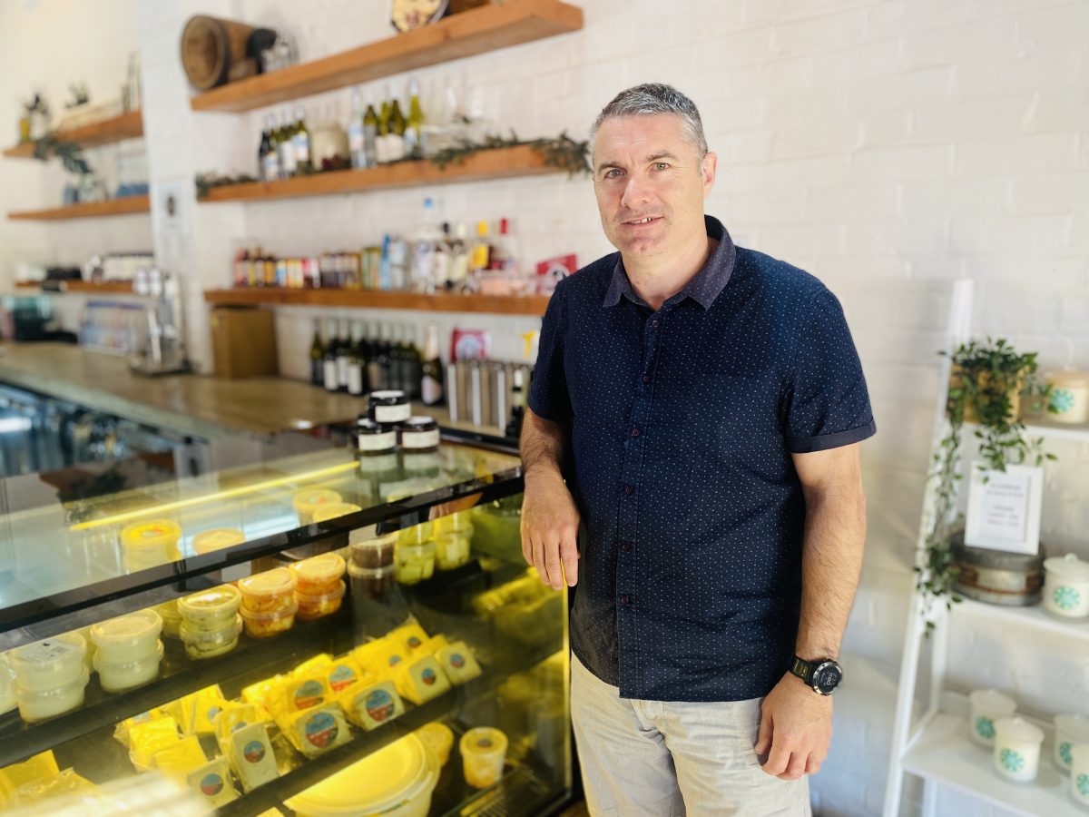 Keiran Spencer standing at cheese counter