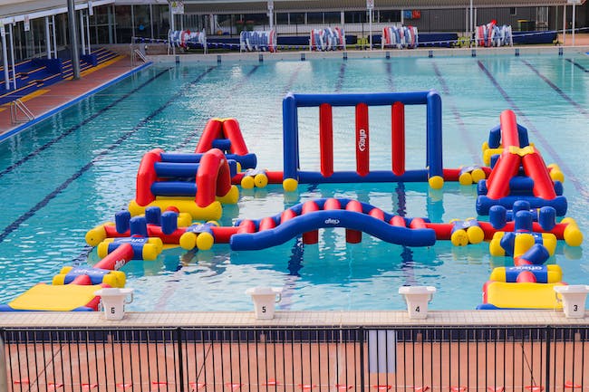 Inflatable obstacle course in a pool