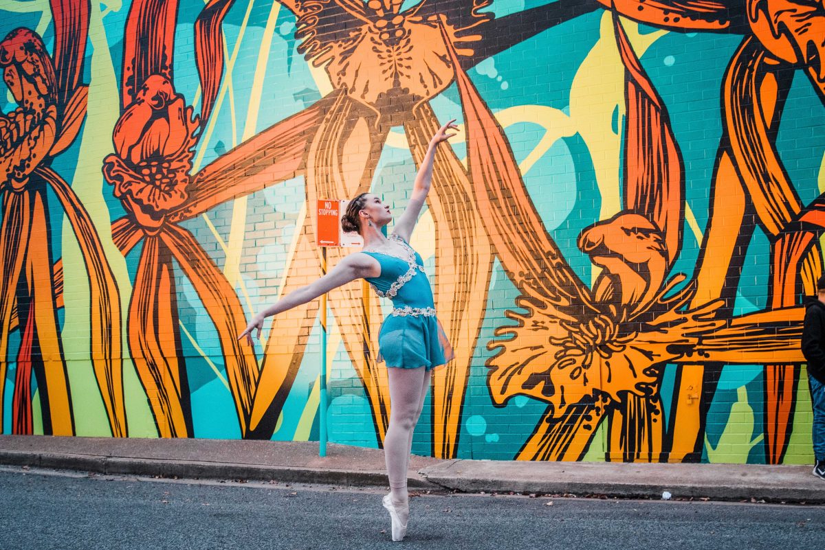 Griffith dancer Ellise Pellizzer in front of a Banna Lane mural