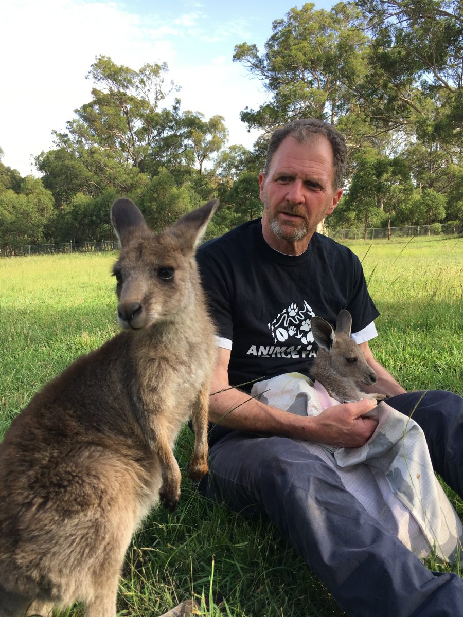 Greg Keightley next to a kangaroo