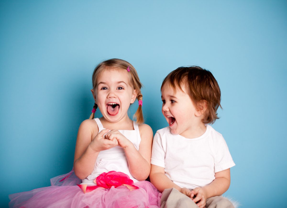 Two little kids laughing 