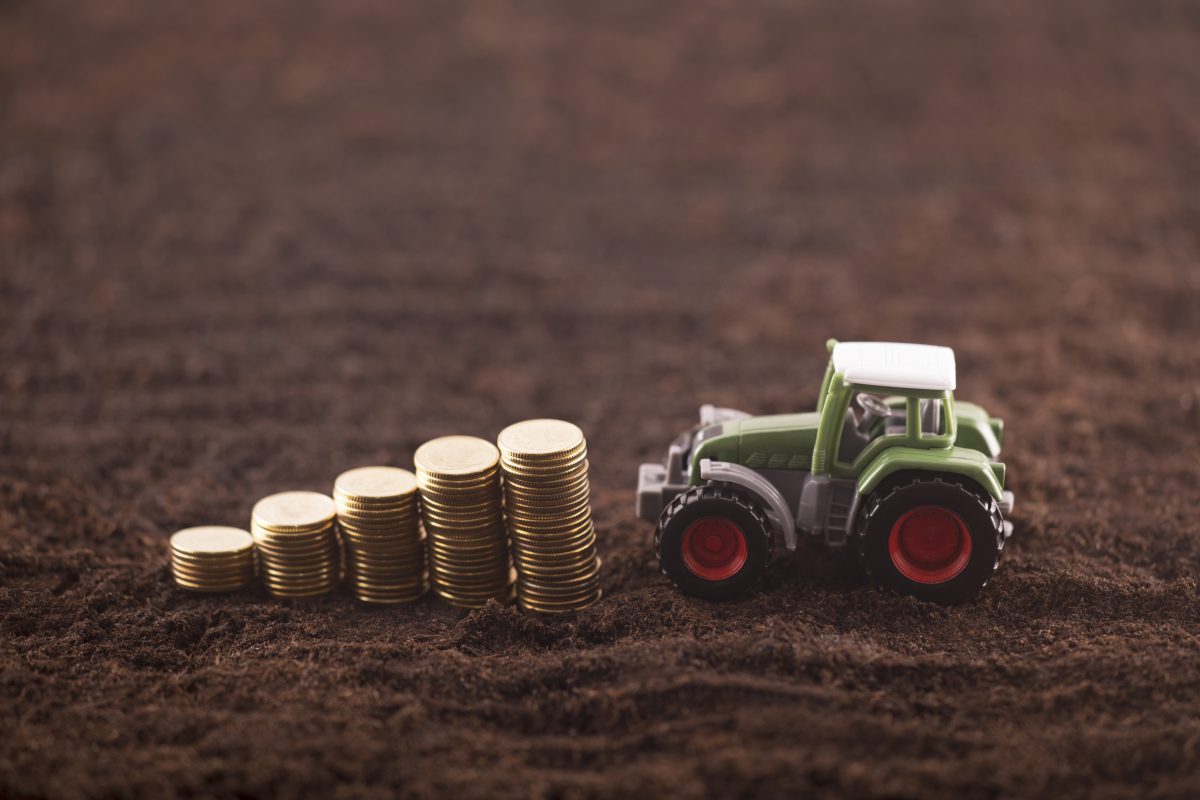 model tractor and coins