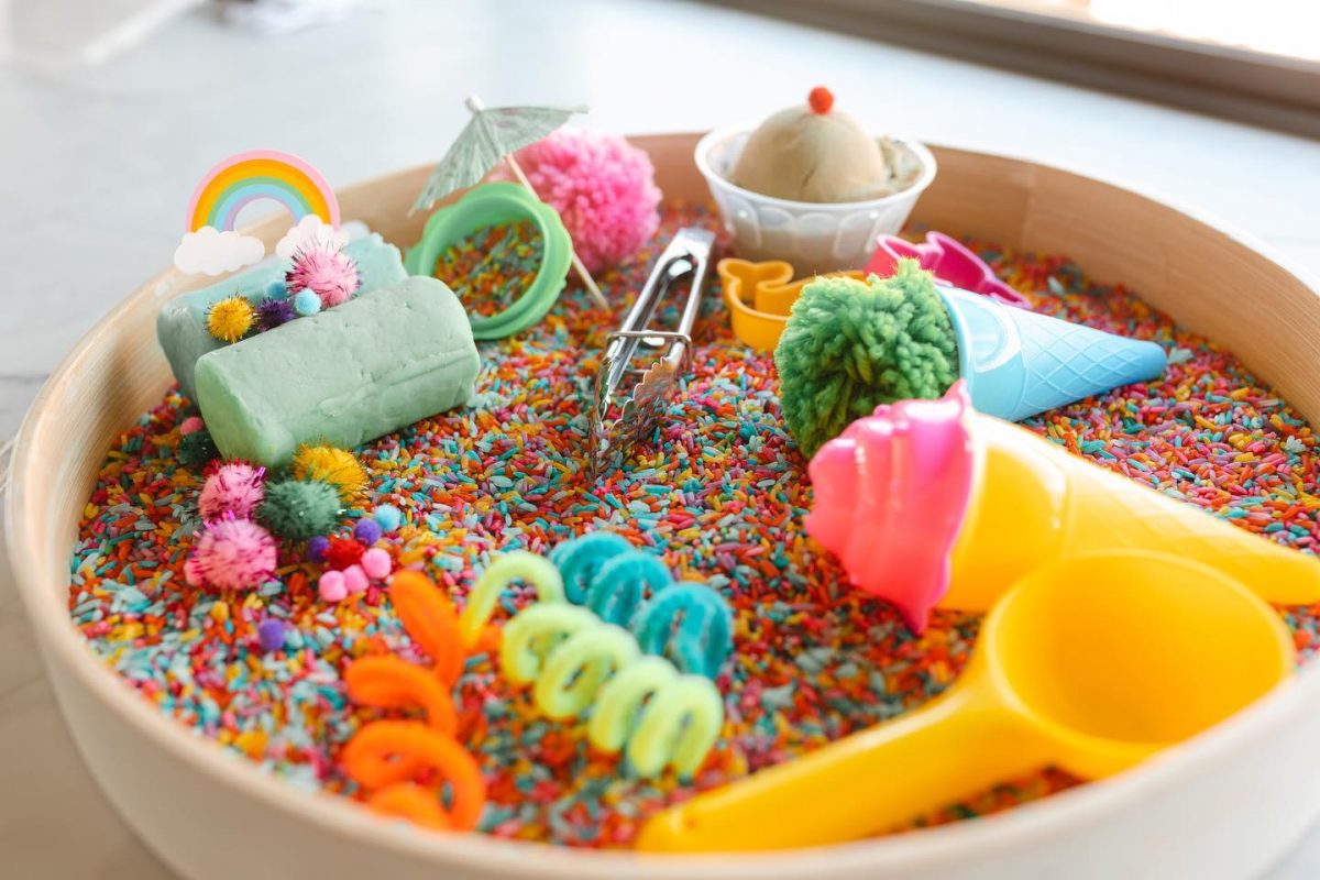Bowls of colourful sensory toys by The Happy Bucket