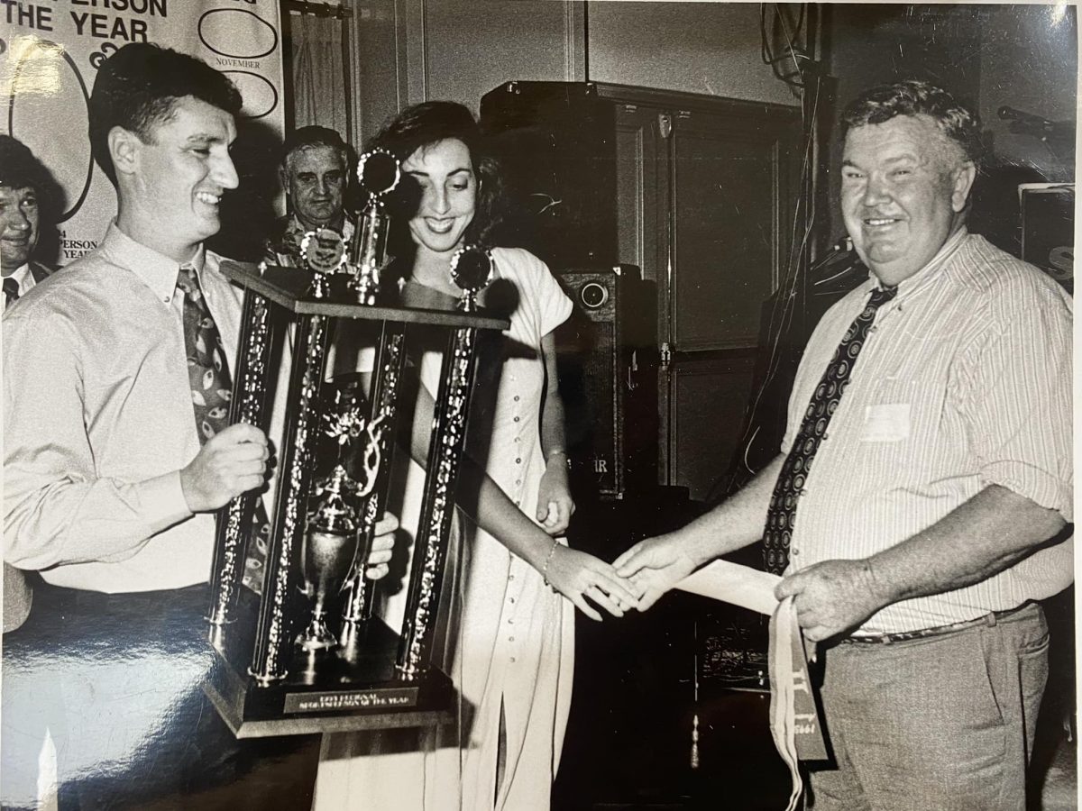 Paul Pierotti in old photo with trophy 