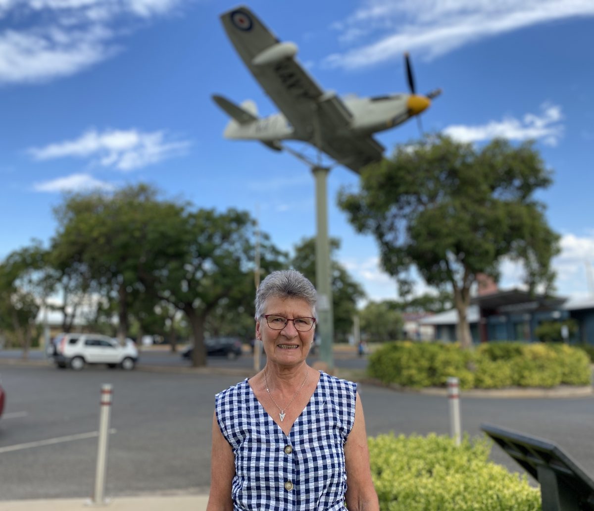 Sue Wade in front of airplane