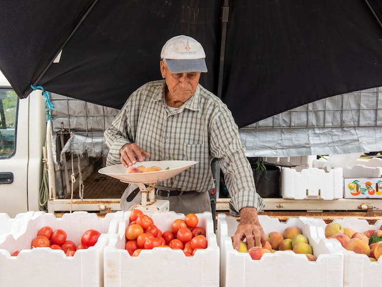 Man with boxes of fruit