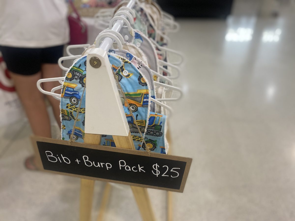 Rack of 'Bib and Burp Packs' 
